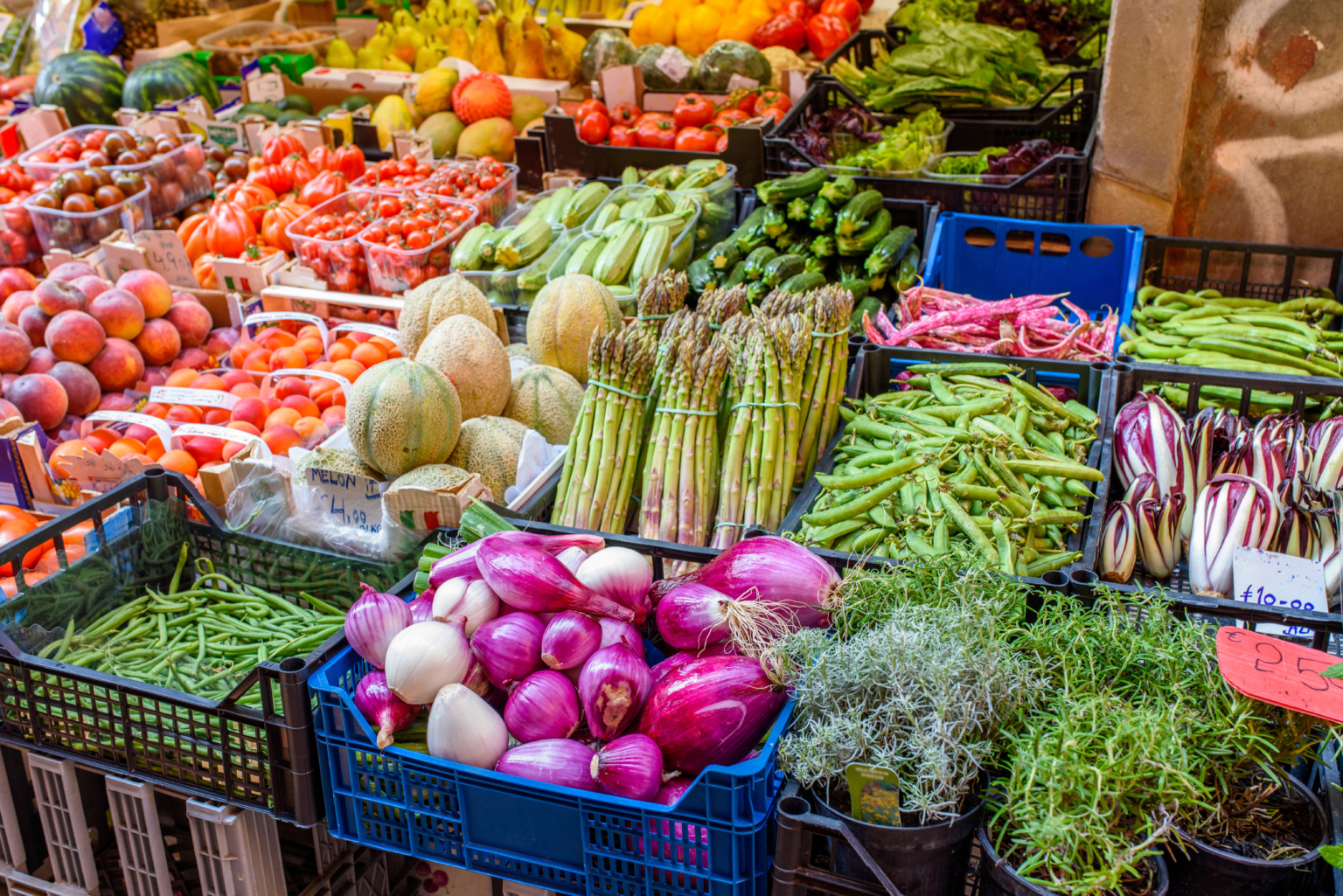 Food market in the center of Bologna, Italy. Early summer. Selective focus.