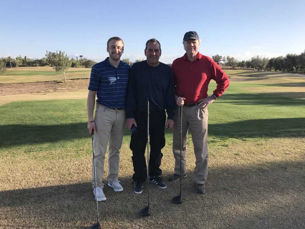 Odysseys employee Robbie V. (left) with Odysseys guests Luke (middle) and Sam (right) at Al Maaden Golf 