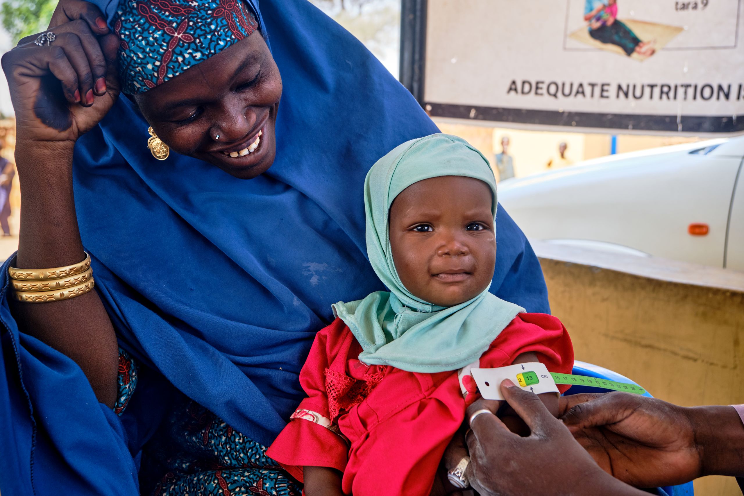 Nigeria: Halima Bukar, 30, regularly brings her one-year-old daughter Hauwa Bukar to the IRC’s Sida-funded outpatient therapeutic programme (OTP) clinic for malnutrition treatment and medical check-ups. Hauwa was previously diagnosed with severe acute malnutrition (SAM) but is now steadily recovering through the IRC’s health care services. © International Rescue Committee Photo: Karl Bergbom for the IRC