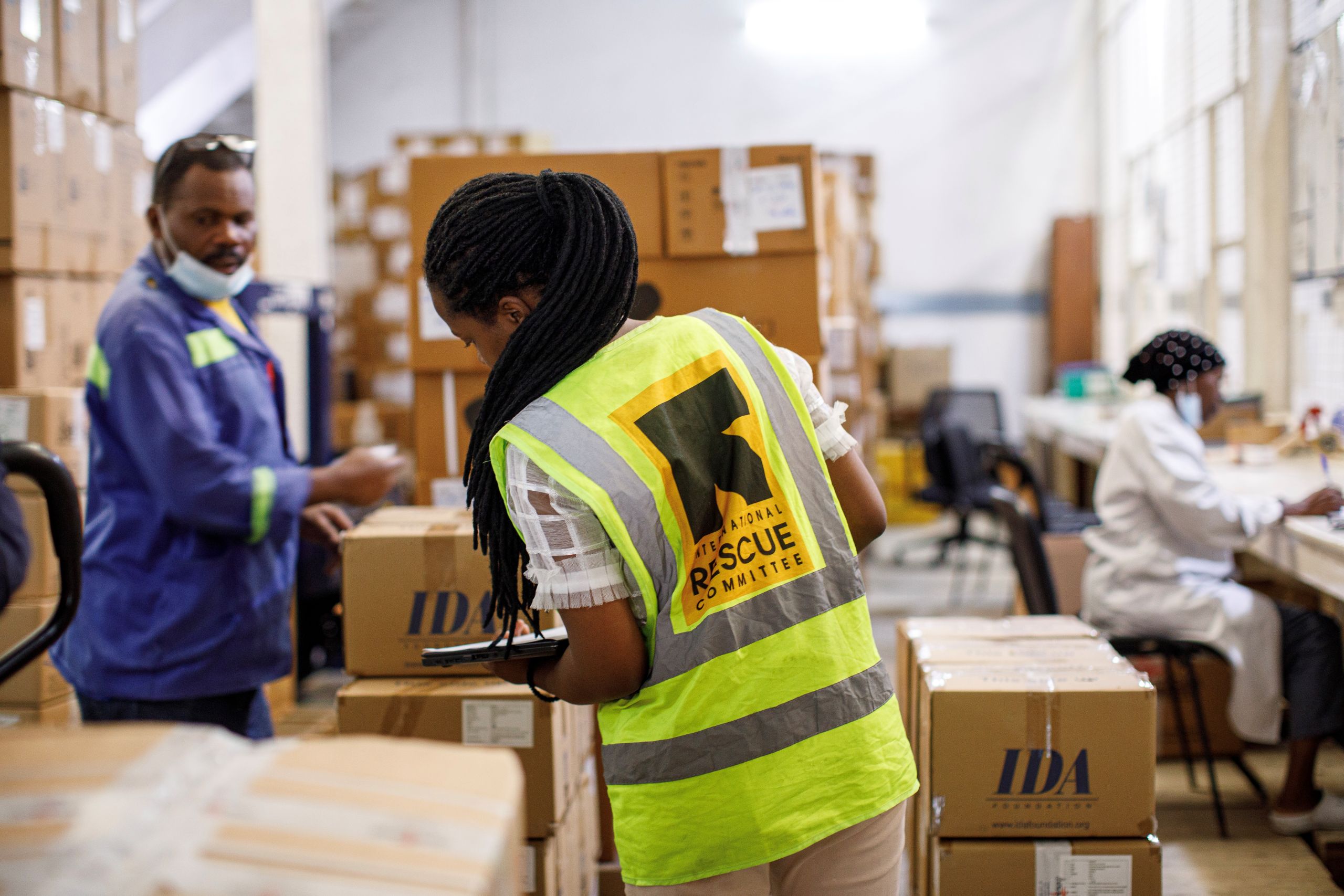 At the ASRAMES warehouse in Goma, DRC, IRC teams are packing IPC (Infection Prevention and Control) kits for delivery to Bunia to support health facilities in the prevention and control of Ebola infections. © International Rescue Committee Photo: Esther Kashemwa for the IRC