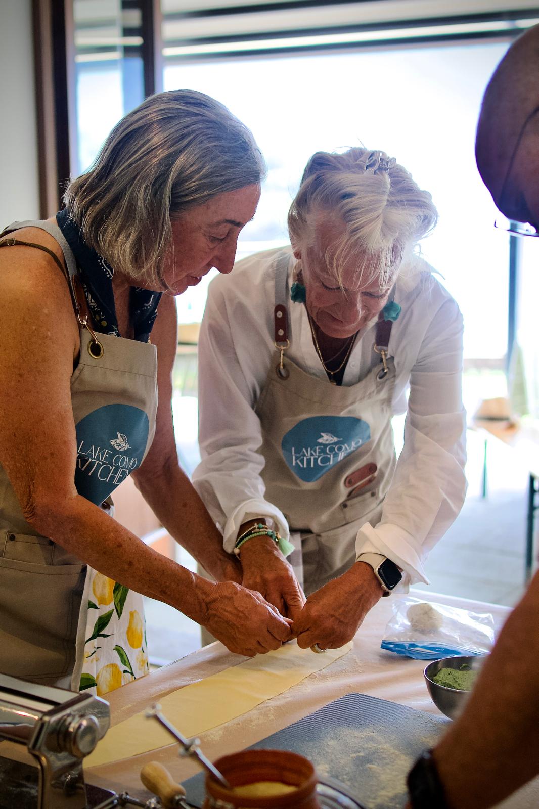 Guests enjoying a cooking class on our Majestic Switzerland tour.